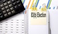 83 b ELECTION text, written on a sticker with calculator,pen on the chart background