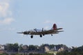 B-17 Flying Fortress Flying over Houses and Trees Royalty Free Stock Photo