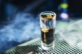 B-52 layered cocktail shot on fire placed on a bar counter with copy space Royalty Free Stock Photo