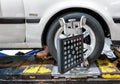 BANGKOK, THAILAND - SEPTEMBER 01: B-Quik at BigC Petchkasem performs wheel alignment procedure on a Older model Toyota with plate