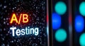 A b testing concept illuminated on a dark screen with bokeh lights Royalty Free Stock Photo