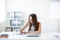 B usiness woman working in office with documents