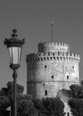 B&w one urban metal lantern with one lamp just against a clear s