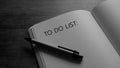 B/W To do list writing on notebook.