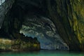 Ba Be Lakes / Vietnam, 03/11/2017: Boat passing on river through giant cave in the Northern Vietnamese Ba Be lakes region