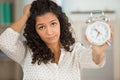 ba usinesswoman holding clock