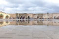 Bab el-Mansour Gate Meknes, Morocco, reflections of gate in puddle Royalty Free Stock Photo