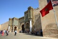 Bab el-Mansour gate and moroccan flag