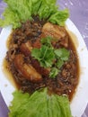 Babi Hong, porkbelly dish, braised & steamed in numbers of chinese seasonings, with shitake mushroom & dried salted mustard greens Royalty Free Stock Photo