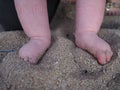 Babies feet in sand, Bali Royalty Free Stock Photo