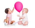 Babies girls play red ballon Royalty Free Stock Photo