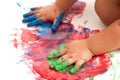 Babies hands painting colorful mosaic.