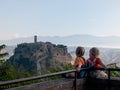 Babies looking at Civita di Bagnoregio. Italy Royalty Free Stock Photo