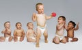 Babies Looking At Toddler Take First Steps Royalty Free Stock Photo