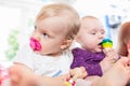 Babies with pacifier in toddler group playing with toys Royalty Free Stock Photo