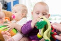 Babies with pacifier in toddler group playing with toys Royalty Free Stock Photo