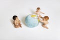 Babies Playing With Globe Royalty Free Stock Photo