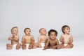 Babies Sitting Side By Side Looking Away Royalty Free Stock Photo