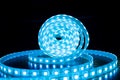 babin of glowing decorative LED strip of blue cold color on a black background Royalty Free Stock Photo