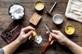 Babrer workplace with tools on wooden background top view