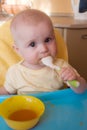 The baby of 7-8 months eats mashed potatoes