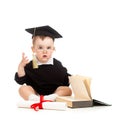 Baby in academician clothes with roll and book