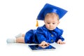 Baby in academician clothes using tablet PC