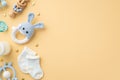 Baby accessories concept. Top view photo of knitted bunny rattle toy blue teether wooden rattle milk bottle tiny socks soother and Royalty Free Stock Photo