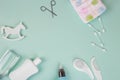 Baby accessories on tiffani background, flat lay. Composition with baby accessories and space for text. Baby cotton swabs, cream,