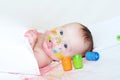 Baby age of 4 months with paper and finger-type paints Royalty Free Stock Photo