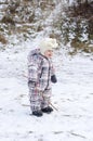 Baby age of 1 year walks on first snow