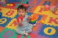 Baby on alphabet mat