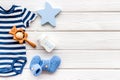 Baby background - blue color. Clothes and accessories for newborn boy on white wooden table top-down frame copy space Royalty Free Stock Photo