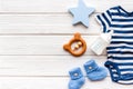 Baby background - blue color. Clothes and accessories for newborn boy on white wooden table top-down frame copy space Royalty Free Stock Photo