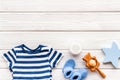 Baby background - blue color. Clothes and accessories for newborn boy on white wooden table top-down frame copy space Royalty Free Stock Photo