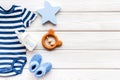 Baby background - blue color. Clothes and accessories for newborn boy on white wooden table top-down frame copy space Royalty Free Stock Photo