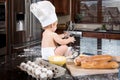 Baby Baker Sitting in Kitchen