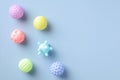 Baby balls toys for bath on blue background. Flat lay, top view. Minimal style Royalty Free Stock Photo