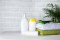 Baby bath amenities, towel, green rubber crocodile and shampoo bottles. The concept of child care Royalty Free Stock Photo