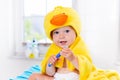 Baby in bath towel with tooth brush Royalty Free Stock Photo