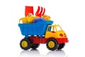 Baby beach sand toys and colorful plastic truck isolated Royalty Free Stock Photo
