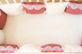 Baby bed crib with white and Burgundy color pillows with laces