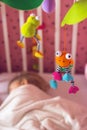 Baby bed with mobile toy above it Royalty Free Stock Photo