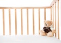 Baby bed with teddy bear for child Royalty Free Stock Photo