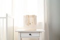 Baby bedroom interior with white wooden nightstand close up Royalty Free Stock Photo