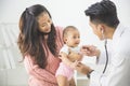baby being checked by a doctor