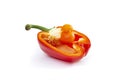 baby bell pepper inside a cross sectioned pepper