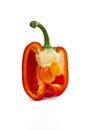 baby bell pepper inside a cross sectioned pepper, isolated