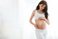 Baby Belly Skin Care. Pregnant Woman With Cream Sun On Skin Royalty Free Stock Photo