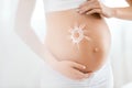 Baby Belly Skin Care. Pregnant Woman With Cream Sun On Skin Royalty Free Stock Photo